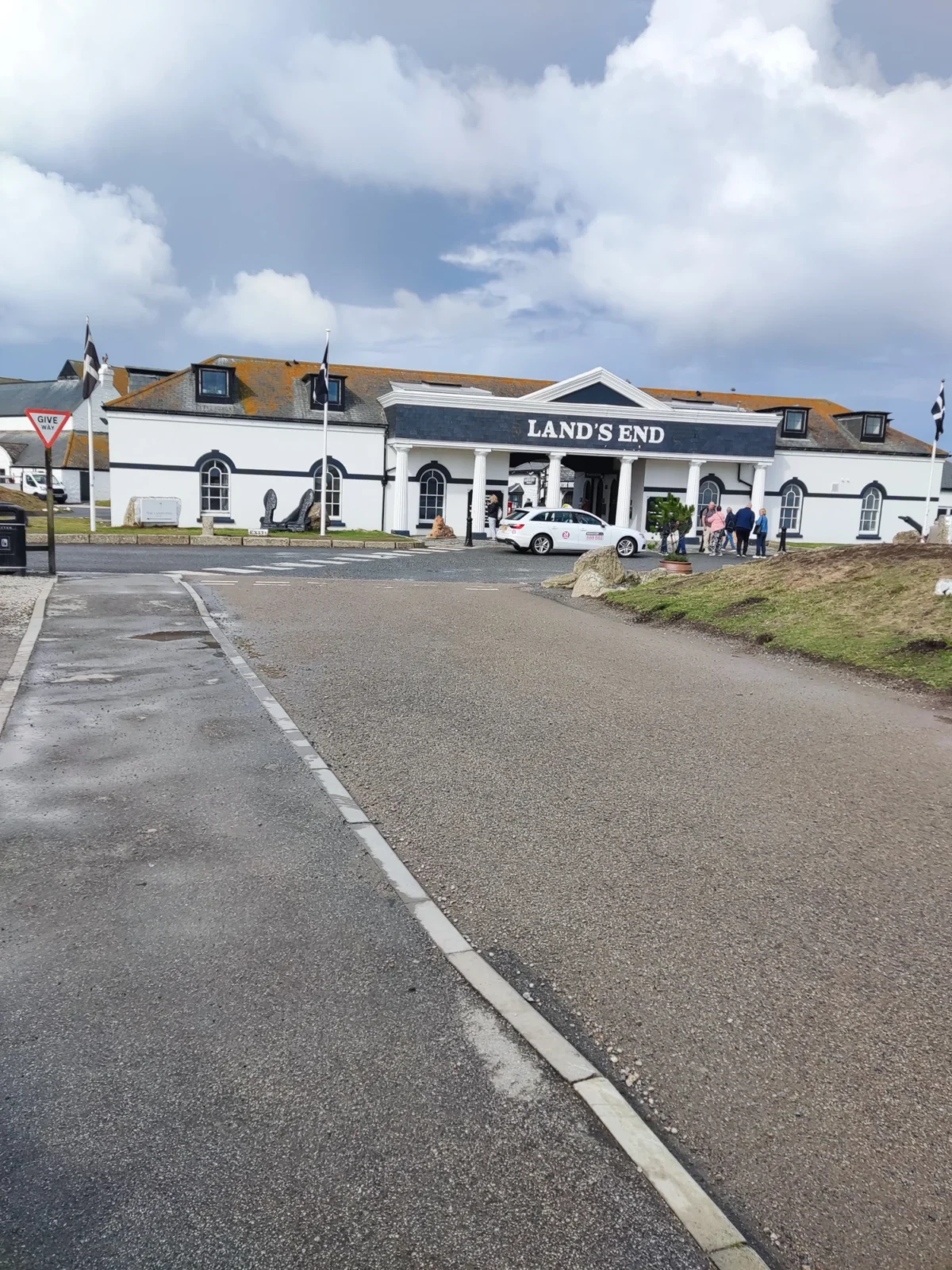 Land's End main visitor building entrance in Cornwall with white colonnaded facade