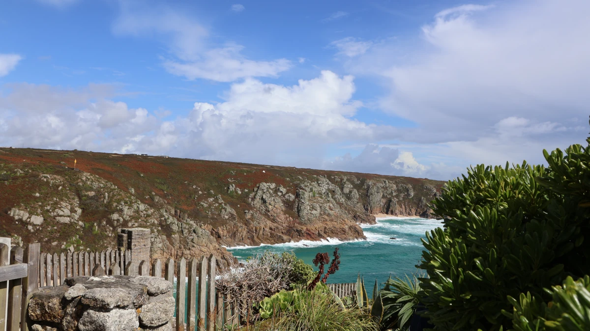 View from the Minack Theatre over the cliffs and turquoise waters of Porthcurno Bay