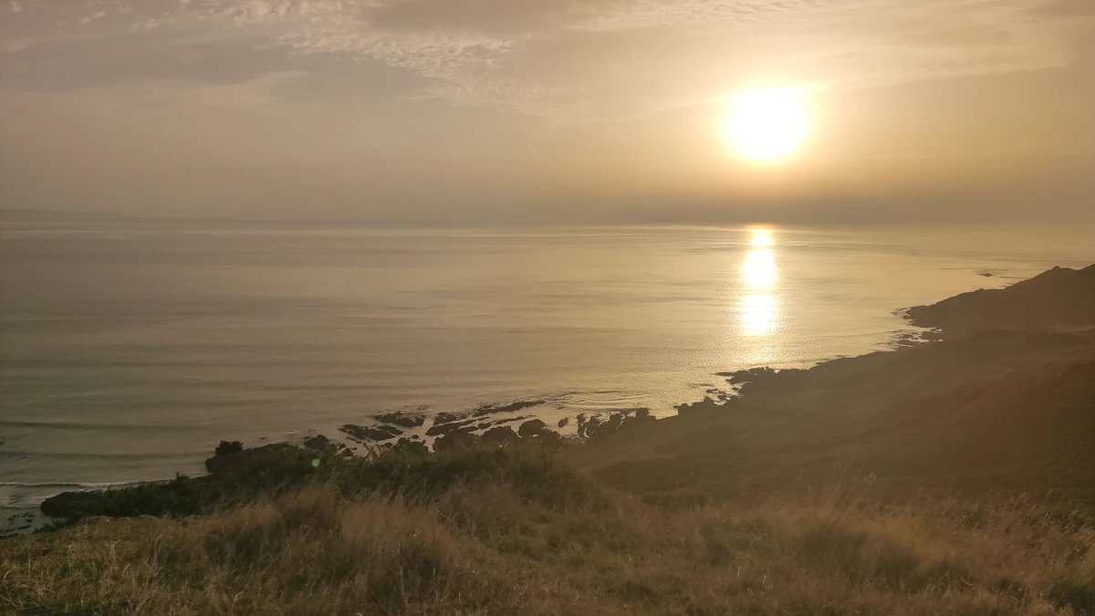 Sunset over the rocky Atlantic coastline near Mortehoe in North Devon